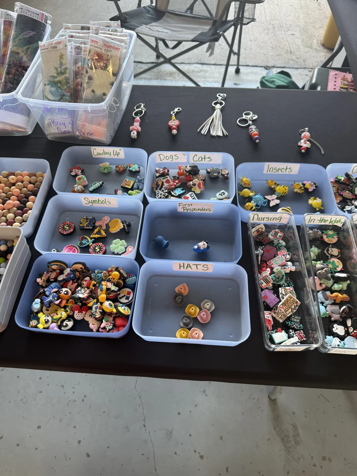 Theme bins filled with animal, insect, career, and hobby charms