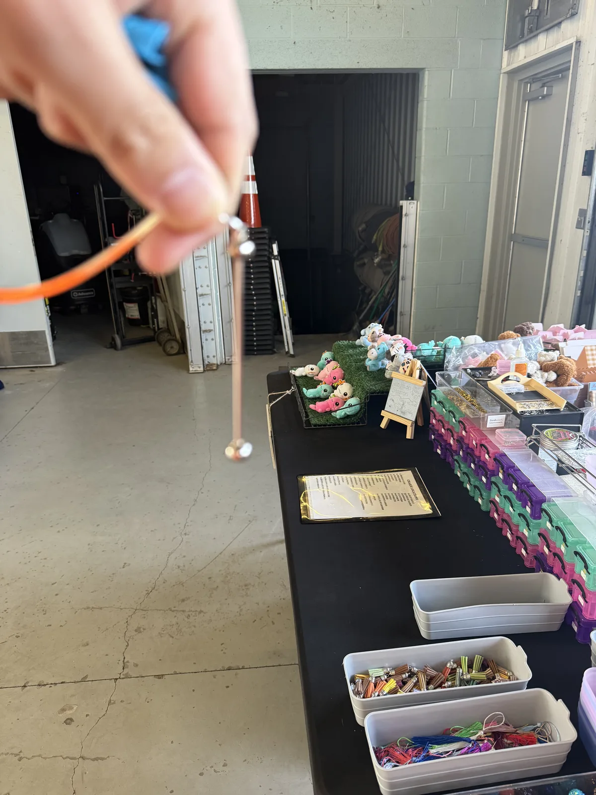 A freshly assembled beaded creation being held up